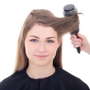 hairdresser-doing-haircut-young-beautiful-woman-isolated-white-background_358320-4519